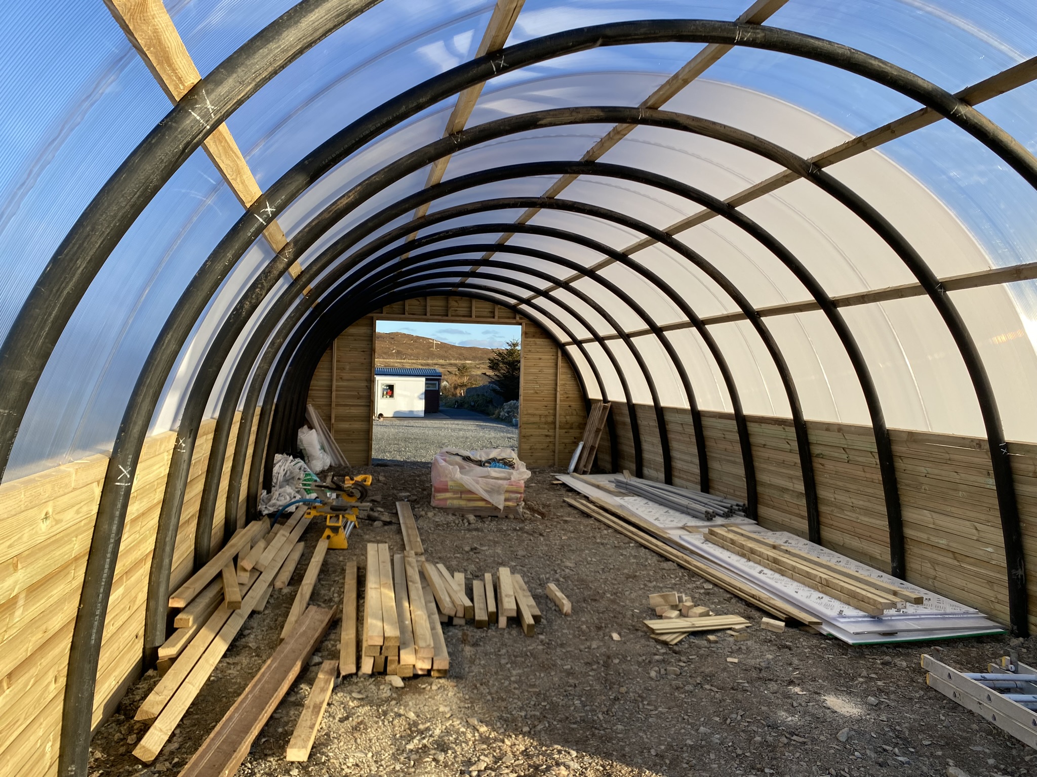 Inside a Polycrub during construction at Growing Spaces Nesting