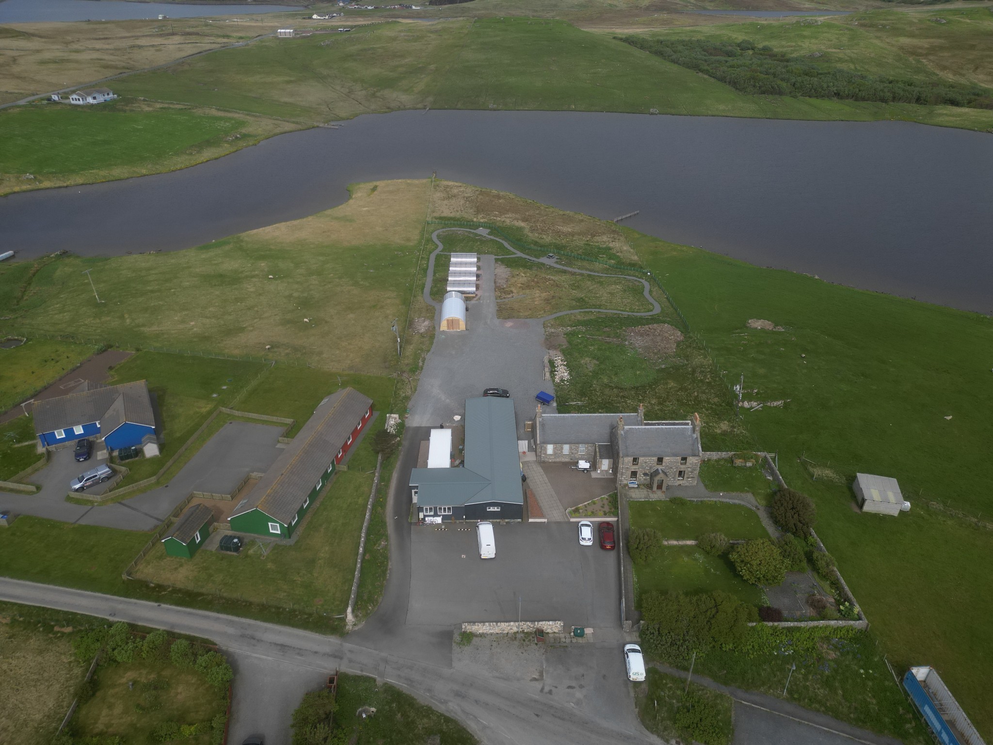 Aerial view of the Aald Skül and community grounds beside Benston Loch