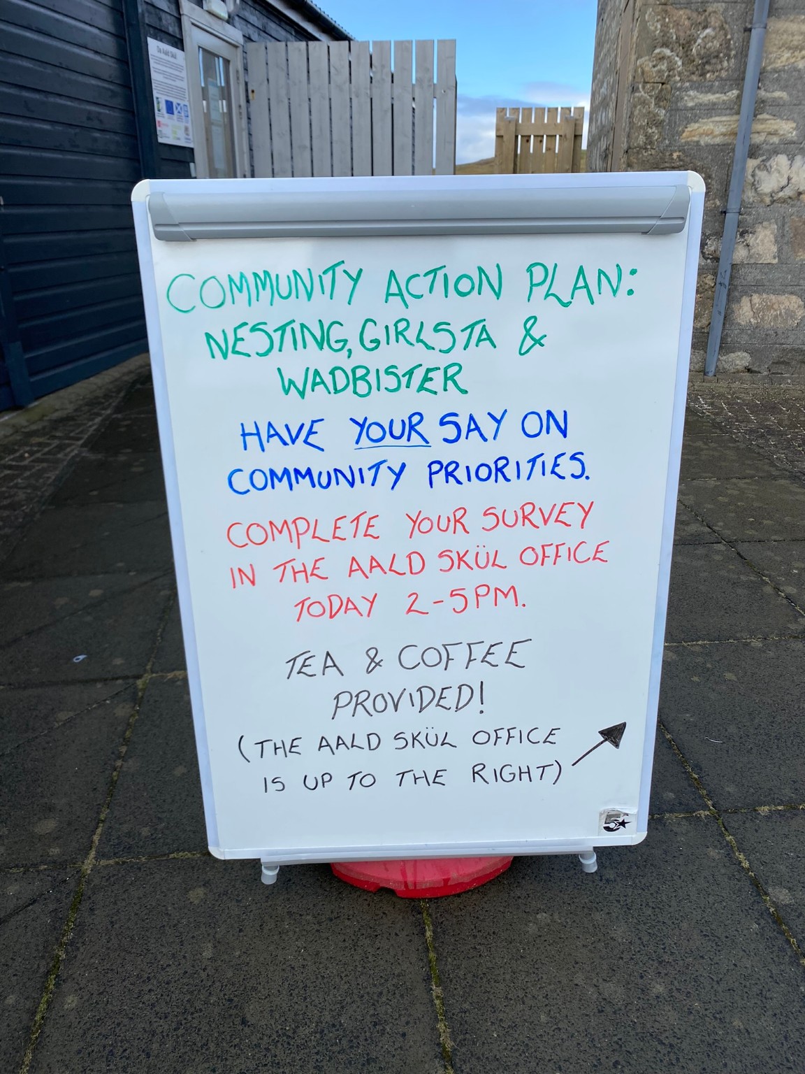Community Action Plan survey sign inviting residents to share their priorities